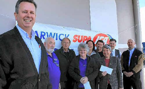 Store manager Rob Norris with recipients Andy Wilson, Ken Hartnett, Kay Wilson, Sam and Steve Farrell, Helen Sexton, Darryl Chapman and John Guthrie. Store manager Rob Norris with recipients Andy Wilson, Ken Hartnett, Kay Wilson, Sam and Steve Farrell, Helen Sexton, Darryl Chapman and John Guthrie.